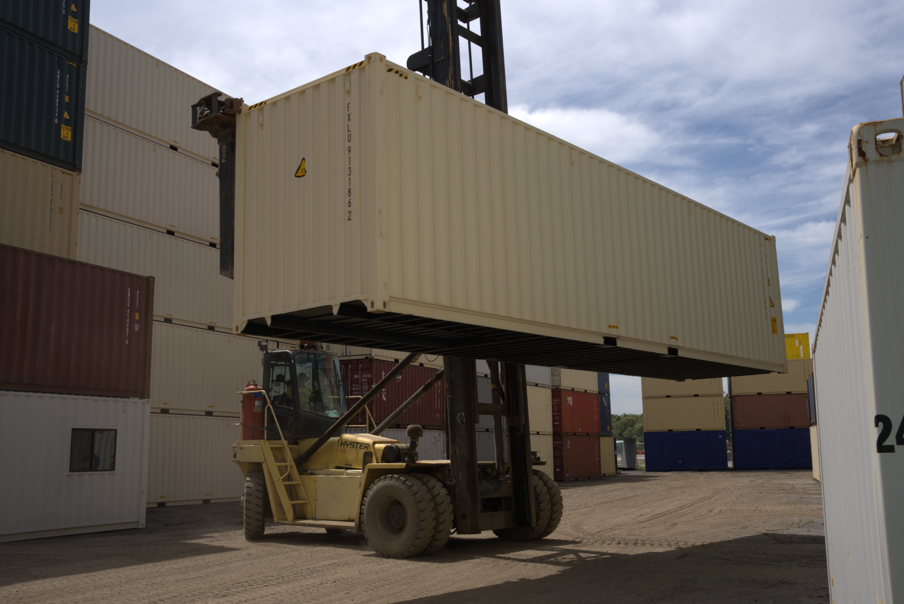40ft shipping container held by a forklift