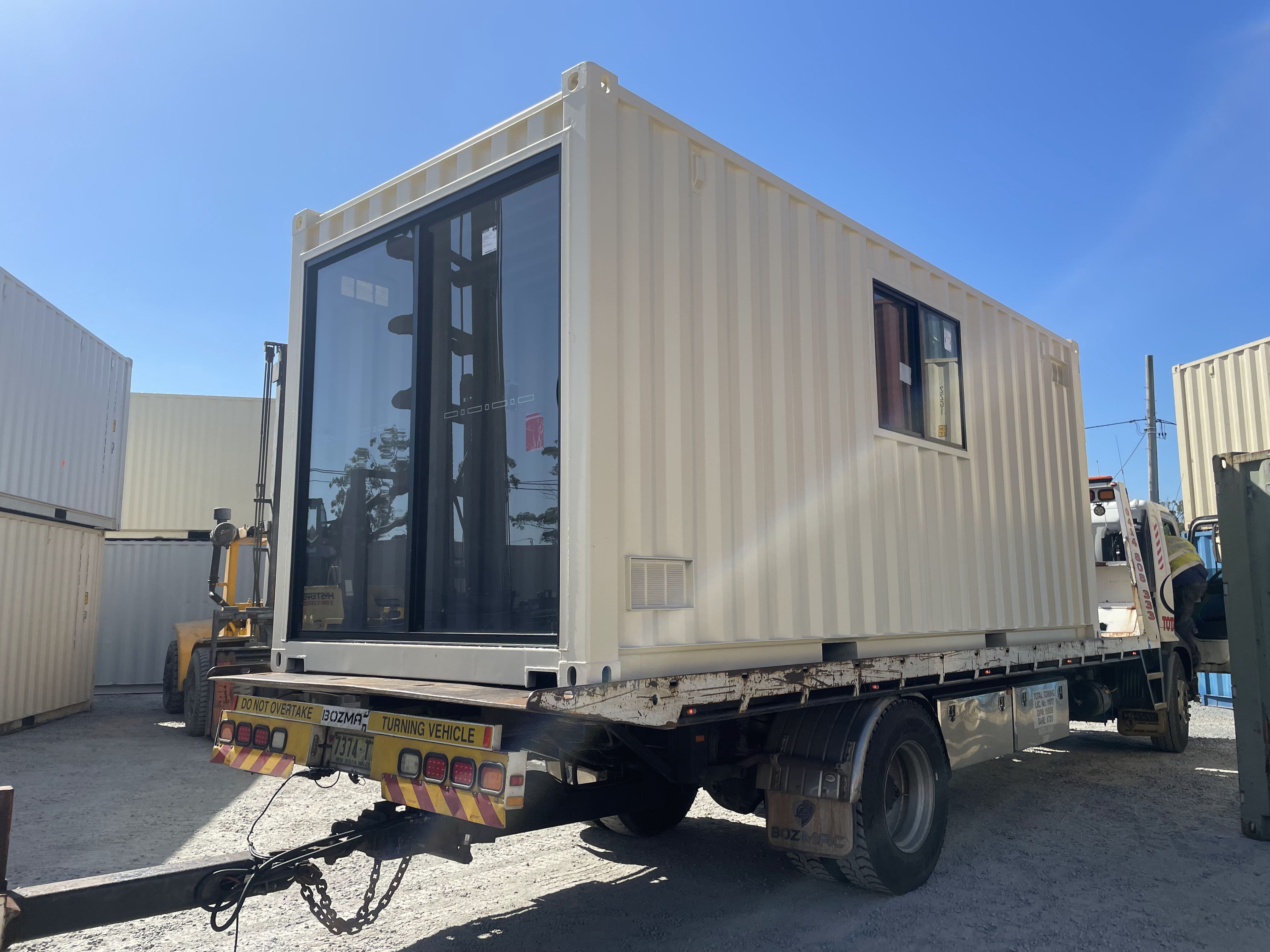 20ft modified shipping container with a glass sliding door